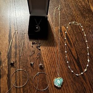 Various Pieces of Elegant Gold and Silver Jewelry